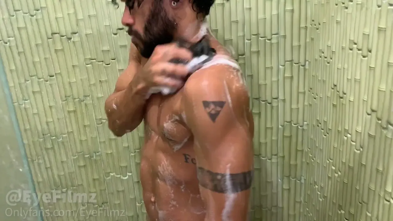 Muscular tattooed gay man Andy Rodrigues masturbates with his big cock