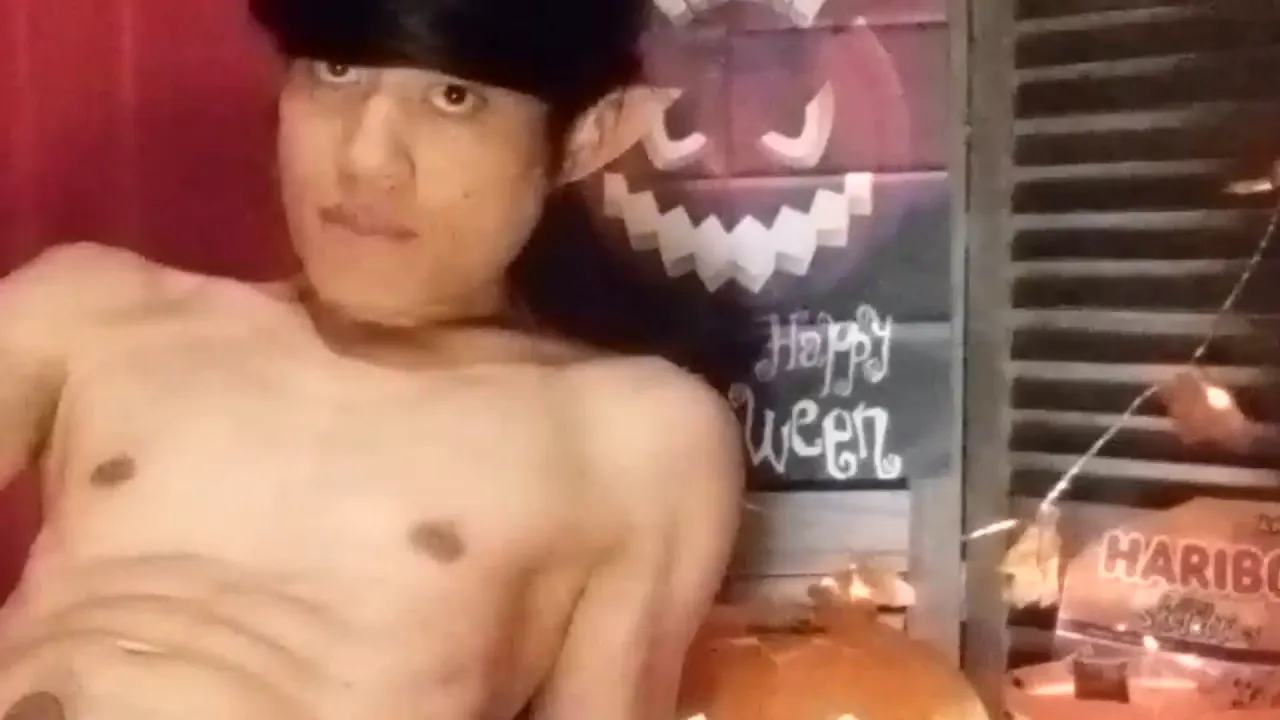 Gay twink Jon Arteen plays with candy cum on his smooth body for Halloween