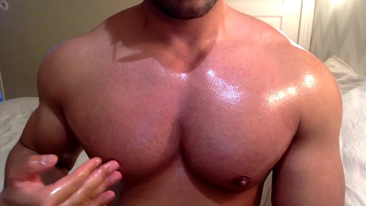 Latino muscle hunk oils and worships his own big bodybuilder chest and nipples in a solo