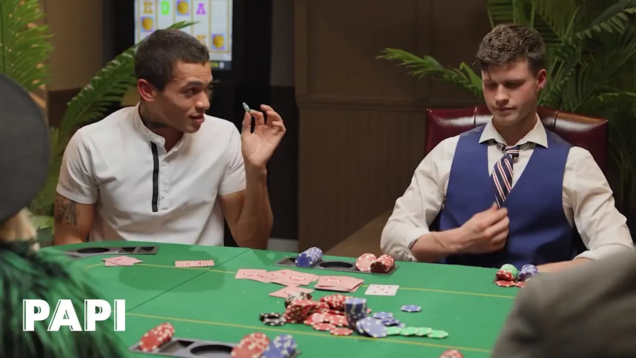 Gay hunks Ashton Summers and Finn Harding play poker while Ashton strokes Finn's big cock