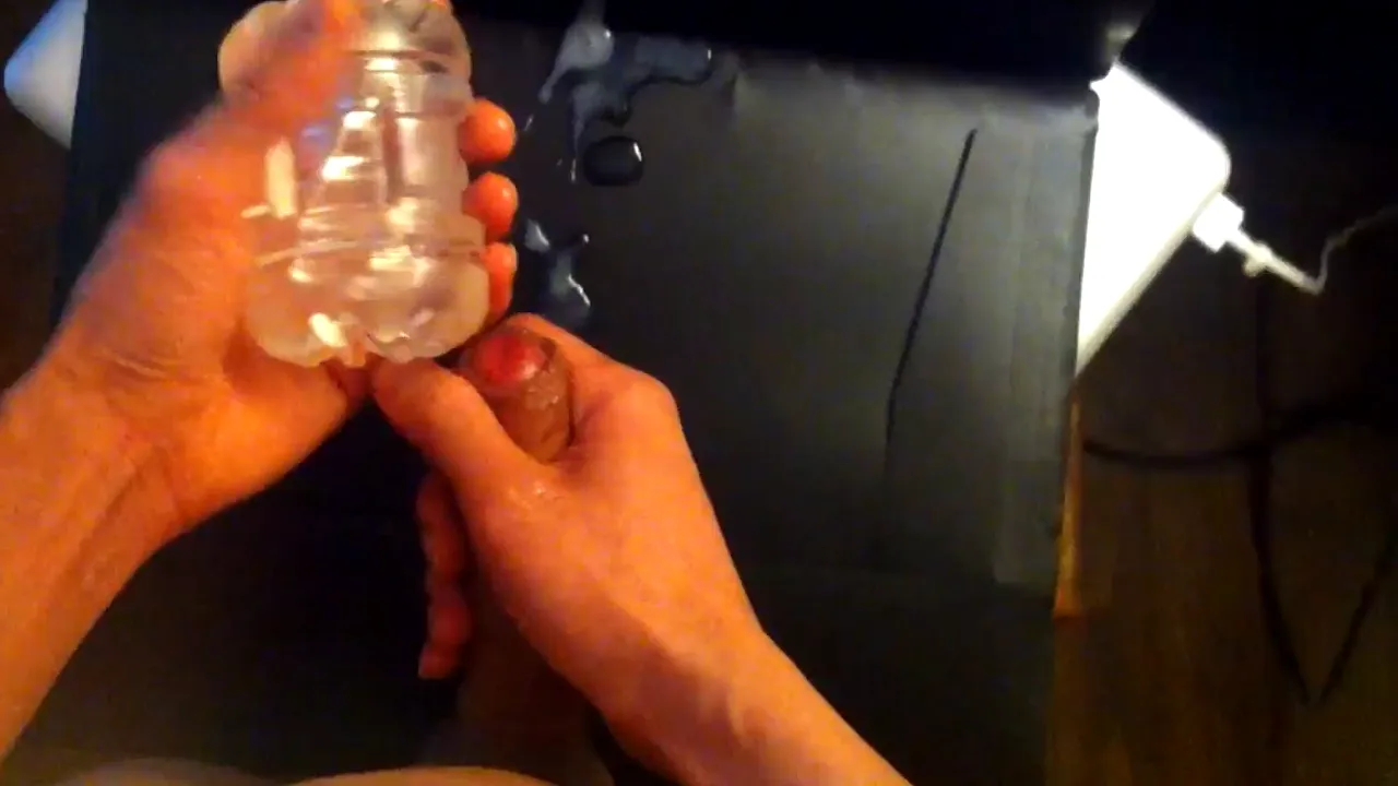Gay twink Jon Arteen wanks shaved cock with lube and Fleshlight Quickshot Vantage until