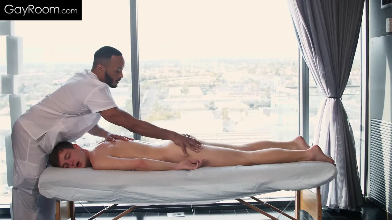 Twink gets his stretched butthole massaged by a black masseuse before getting an
