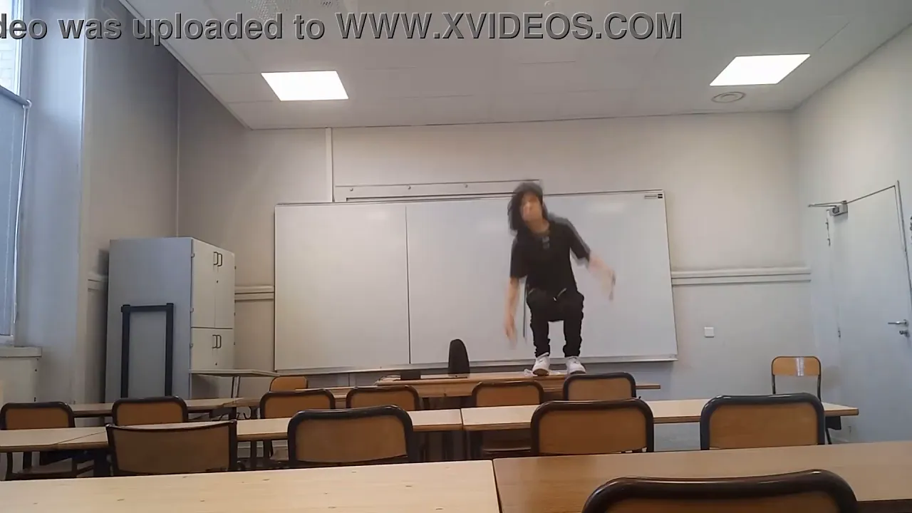 Gay student Jon Arteen wanks his smooth cock and squirts jizz at school in a classroom