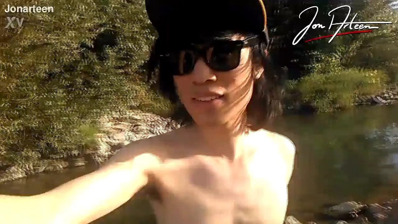 Twink Jon Arteen dances naked and hairy outdoors, showing his full pubes in a strip tease