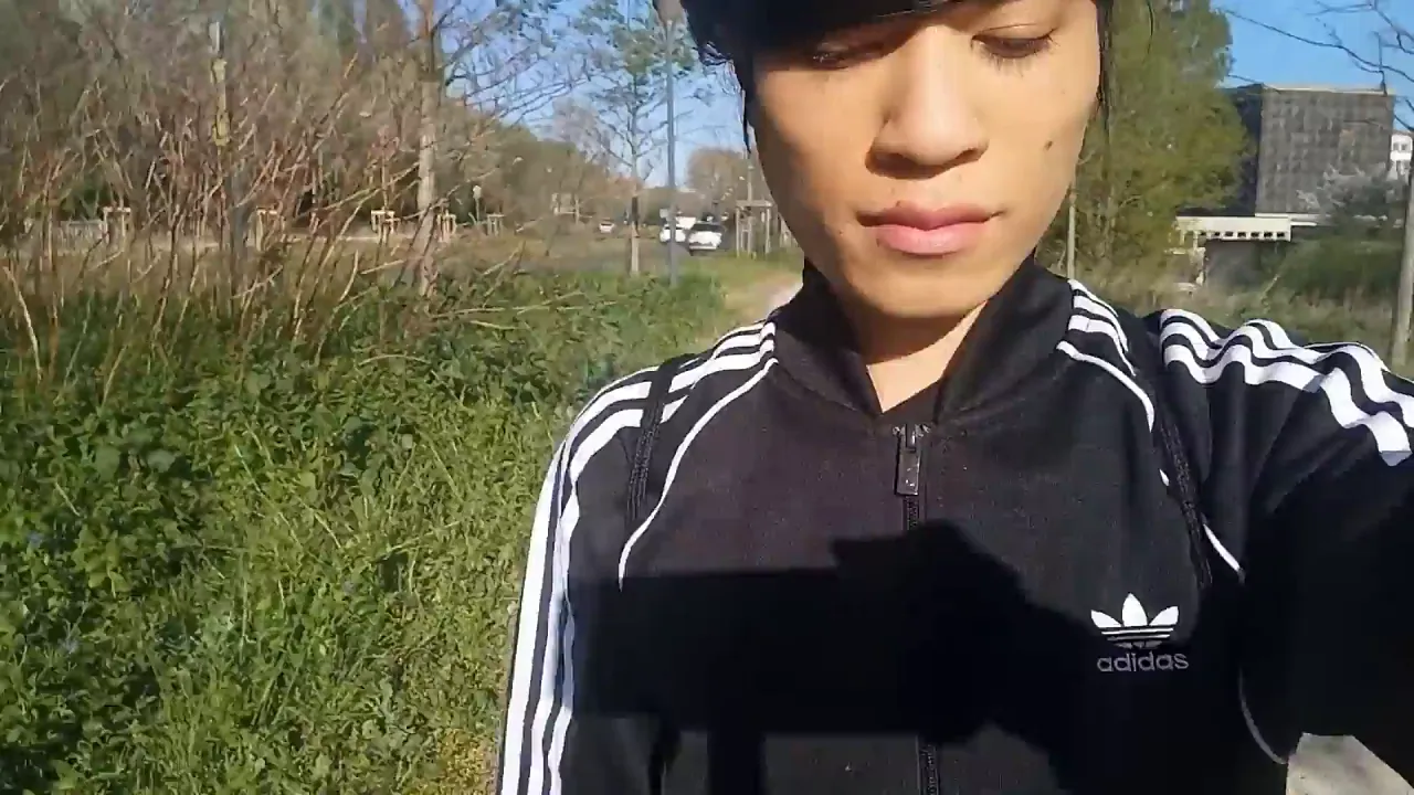 Twink Jon Arteen shows off his freeballing commando style in black Adidas tracksuit and