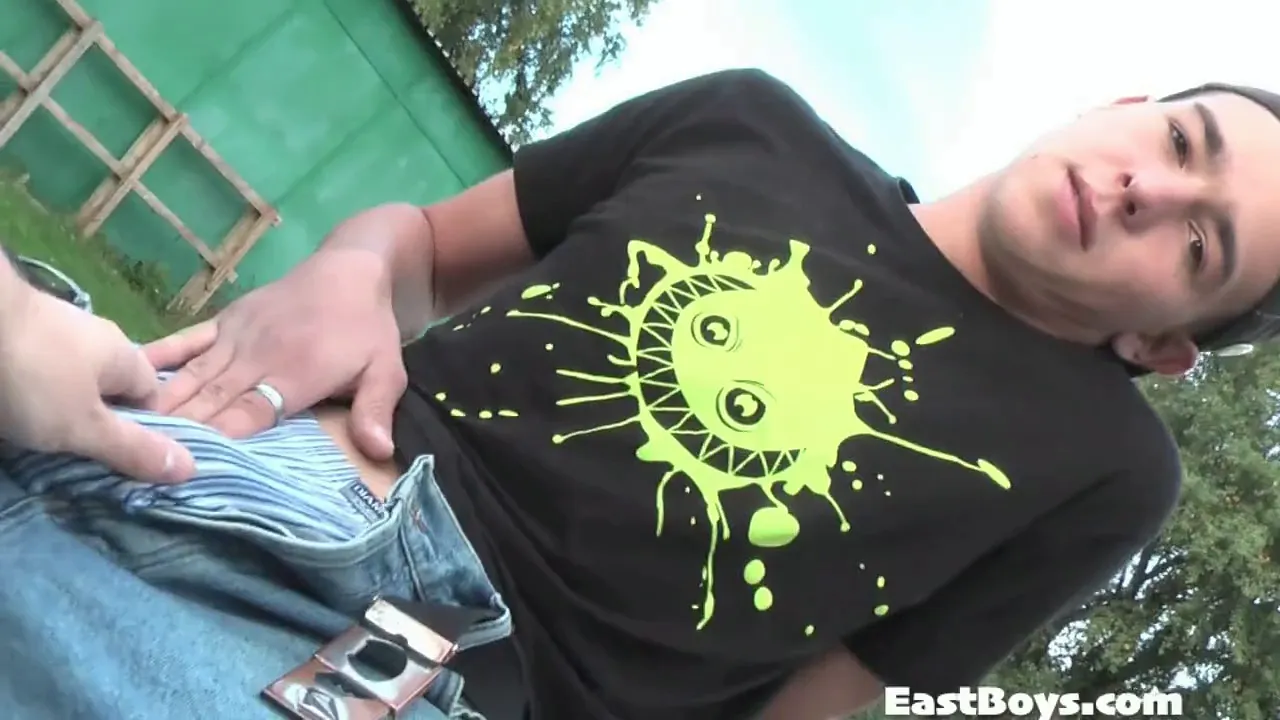 Two gay men give each other handjobs in public