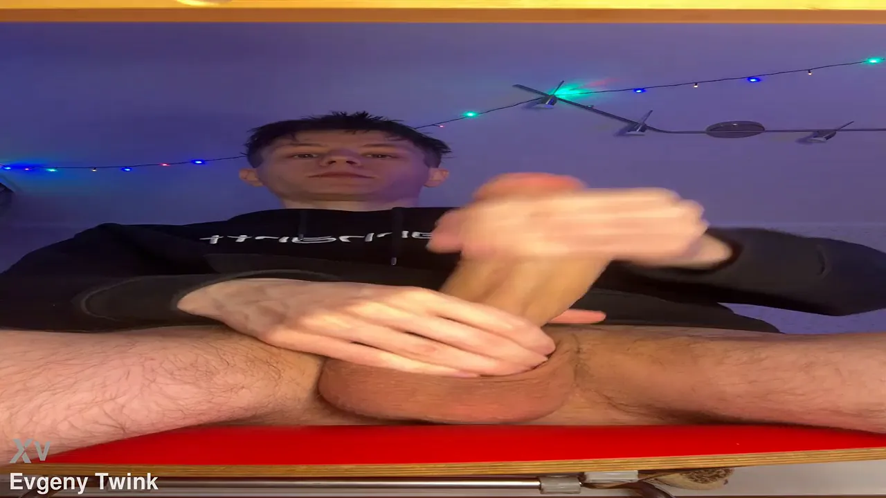 Gay twink Evgeny jerks off with his huge uncut cock in solo video