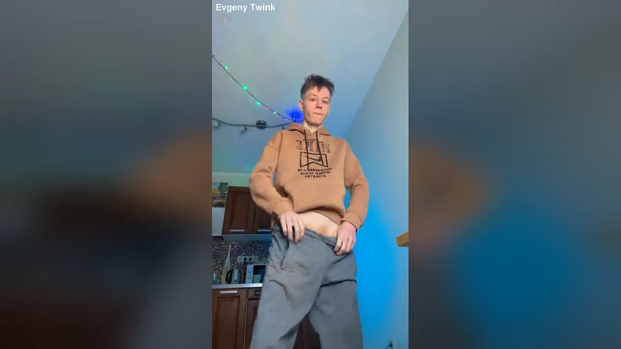 Gay twink Evgeny masturbates with his huge uncut cock in a solo video