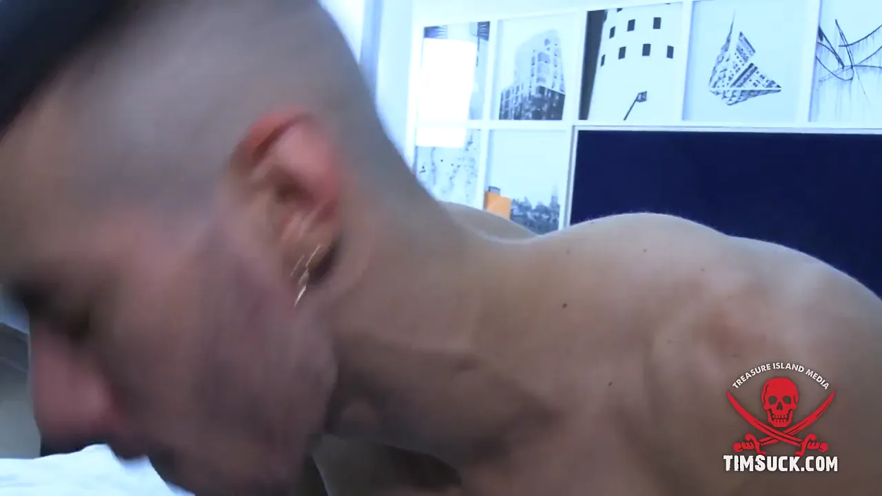 Two tattooed hunks have rough gay sex with a big uncut cock