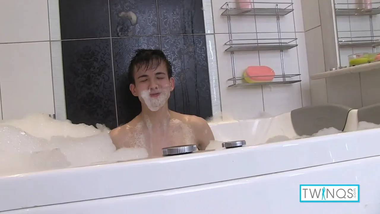 Asian twink Xander H jerks off his big cock in a bubble bath