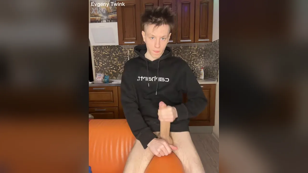 Twink Evgeny Jeans masturbates with his huge uncut cock in solo video